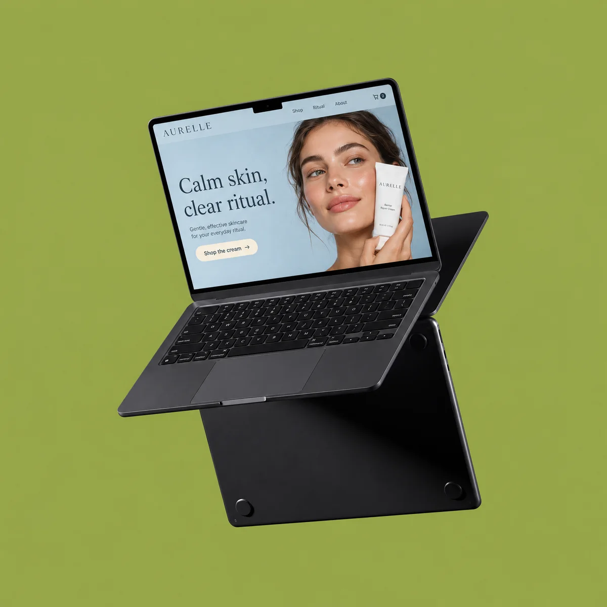 Laptop showing a skincare storefront home page against a flat green backdrop